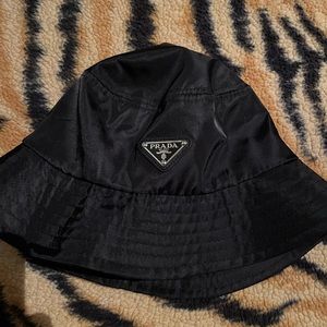 Prada black nylon bucket hat size fits all used but in good condition.